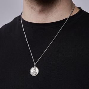 Man wearing Julius Caesar pendant showing Renaissance bust design and sterling silver chain